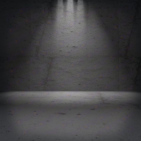 A dark room with a dark wall and a light on the wall